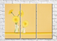 Pictură Rainbow Yellow gerberas in glassware on a beige background (500283)